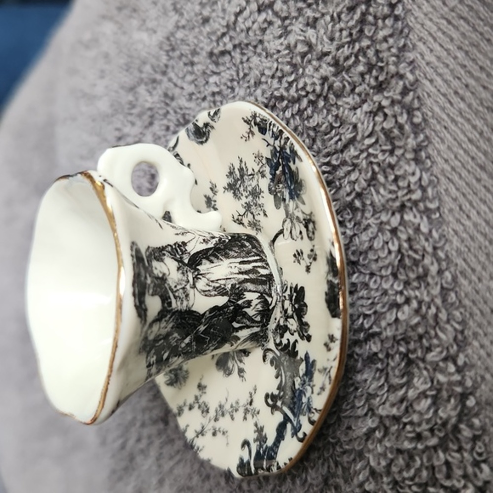 Vintage miniture Alice in Wonderland  ceramic tea Cup with saucer attached